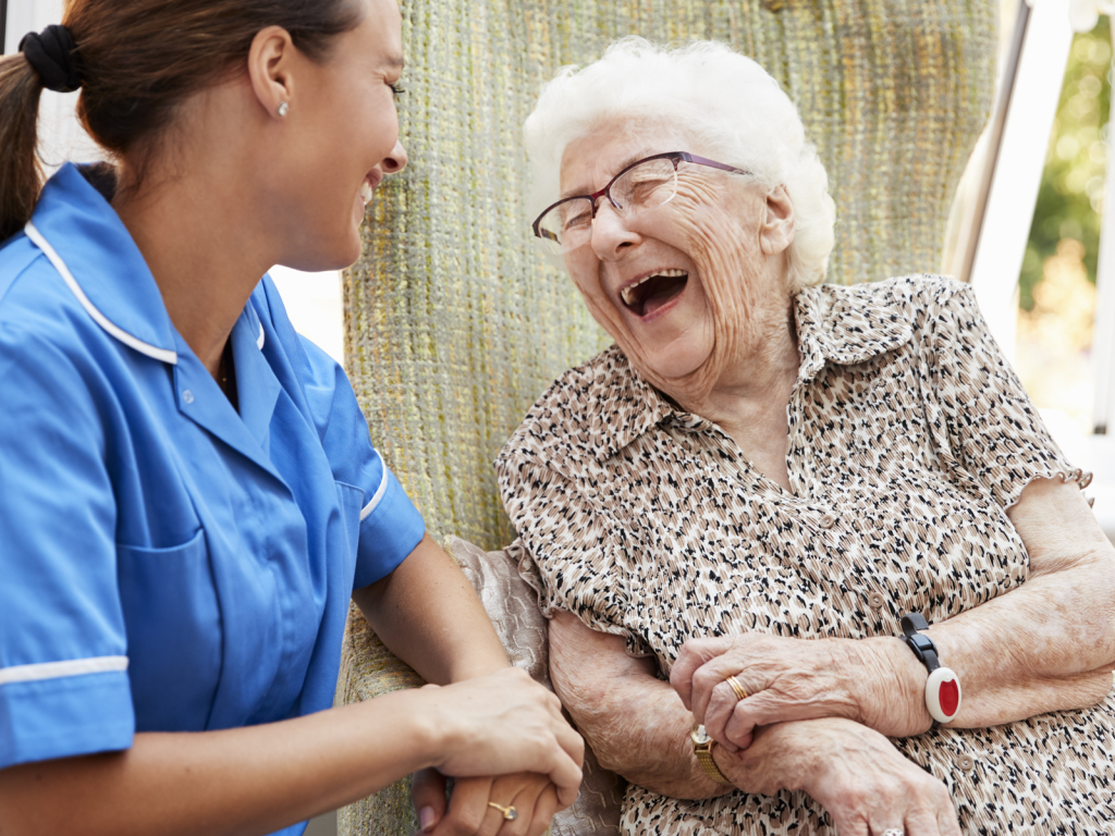 Nurse and Smiling Elderly Patient